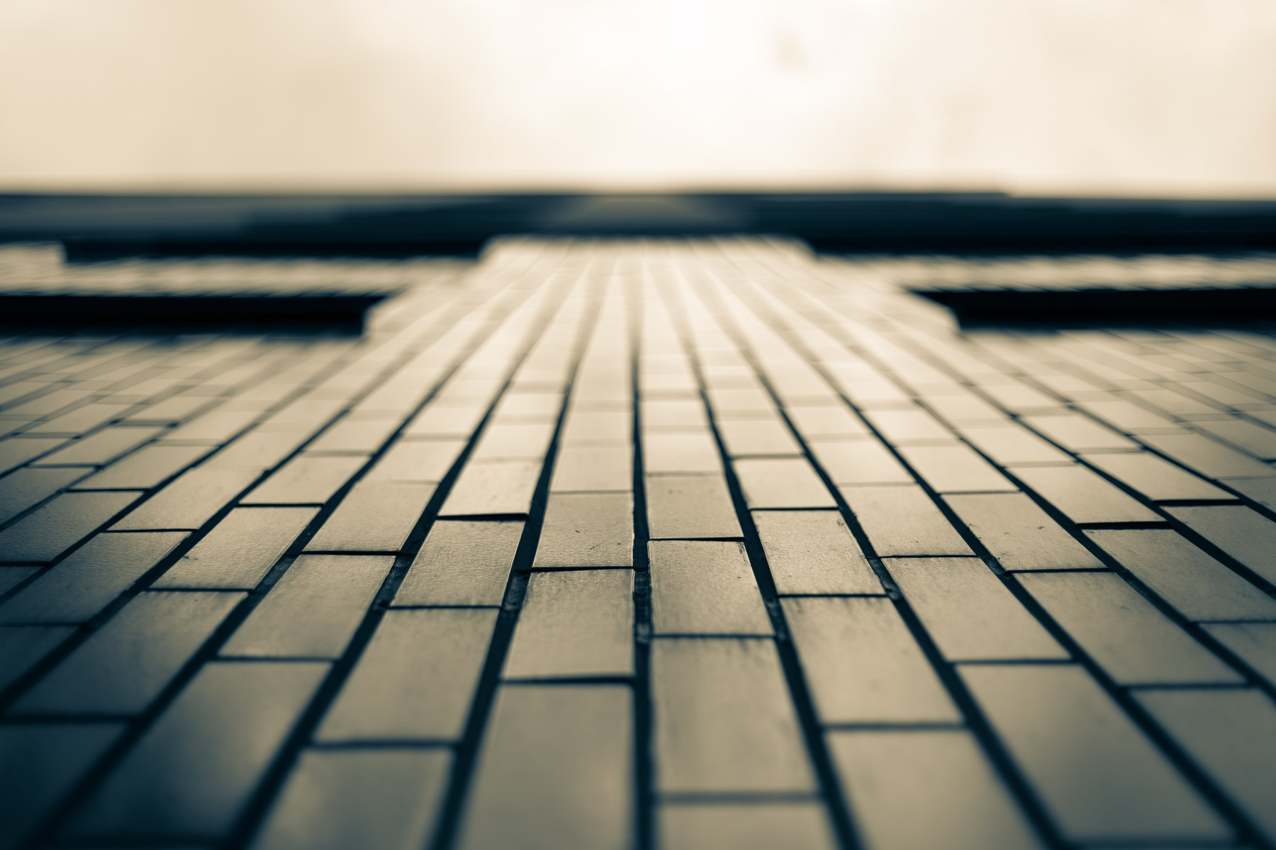 Historic urban facade with repeating geometric patterns suggesting memory and quiet order.